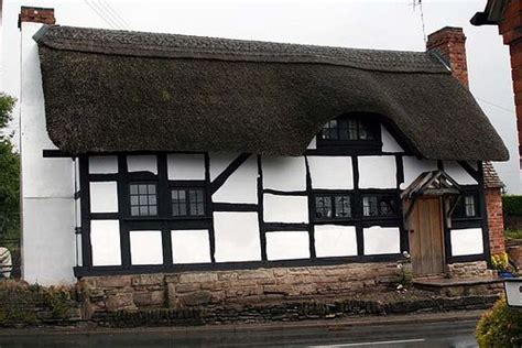 tudor house with thatched roof